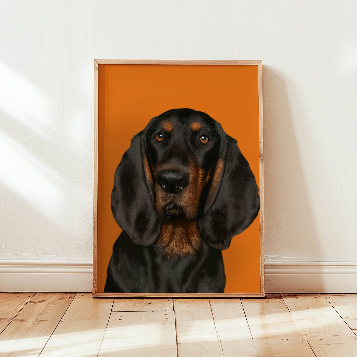 Framed artwork of a black and brown tan coonhound dog on an orange background
