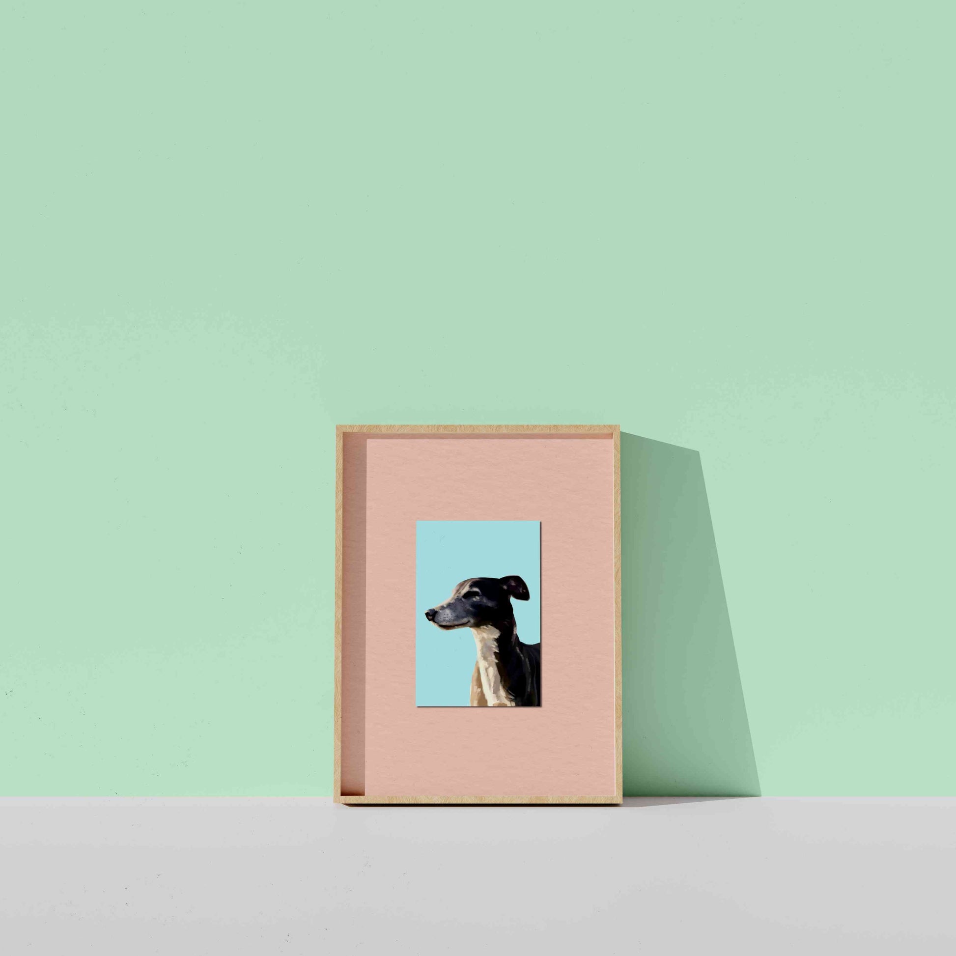 Pink photo frame with a dog portrait on a light green background