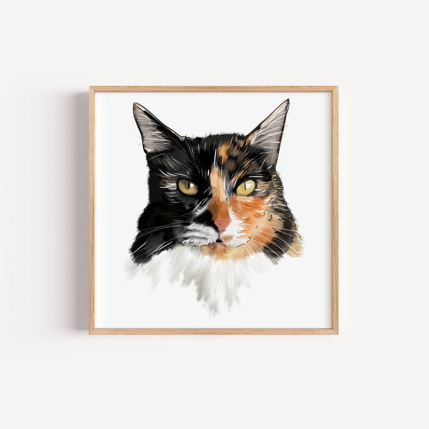 Framed portrait of a calico cat's face on a white background