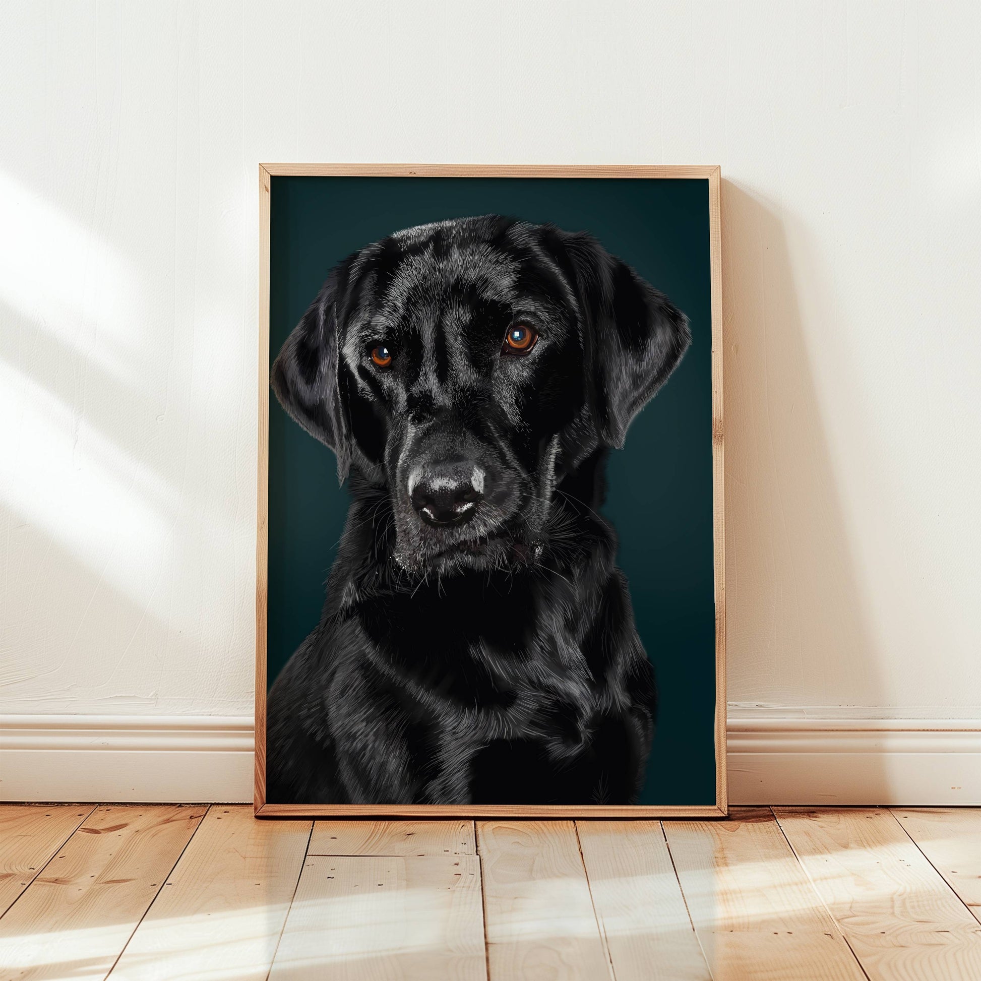 Framed portrait of a black labrador dog on a dark blue background in a room with wooden flooring.