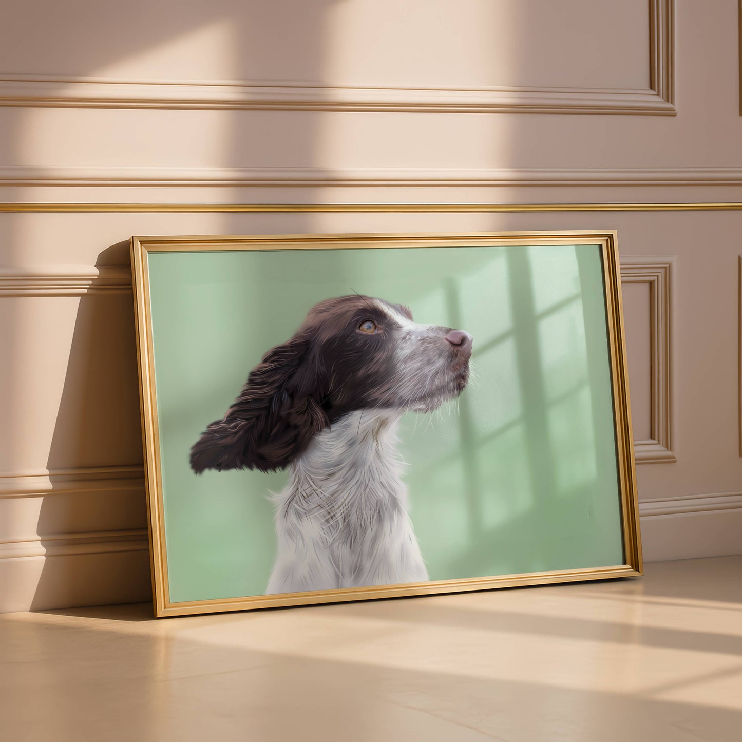 Framed picture of a springer spaniel on a wall with a gold frame